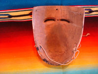 Mexican vintage woodcarvings and masks, and Mexican vintage folk art, a wonderful carved and painted wooden "Mask of the Negrito (Negro)", used in the dance in winter in San Lorenzo, Michoacan, c. 1950.  Photo showing the back side of the mask.