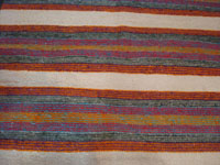 Native American Indian vintage textiles, and Navajo vintage textiles, rugs, and blankets, a beautiful Navajo woven-wool double saddle blanket, with beautiful colors and designs, Arizona or New Mexico, c. 1960's. Closeup photo of a part of the blanket showing the bright colors.