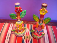 Mexican vintage folk art, a pair of tree-of-life style candlelabras each with a human figure, birds, and wonderful floral art, attributed to the Flores family, Izucar de Matamoros, Puebla, c. 1950's. Main photo of the candlelabras.