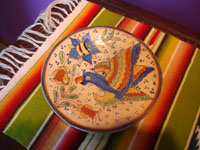 Mexican vintage pottery and ceramics, a Tlaquepaque "starry night" set, including a plate, a saucer, and a cup, all beautifully decorated with very fine artwork, San Pedro Tlaquepaque or Tonala, Jalisco, c. 1930's.  Closeup photo of the saucer with a wonderful parrot.