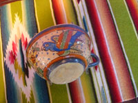 Mexican vintage pottery and ceramics, a Tlaquepaque "starry night" set, including a plate, a saucer, and a cup, all beautifully decorated with very fine artwork, San Pedro Tlaquepaque or Tonala, Jalisco, c. 1930's.  Closeup photo of the cup, also decorated with a parrot.