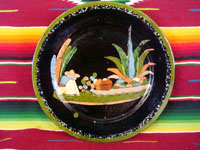 Mexican vintage pottery, a blackware plate from Tlaquepaque, Jalisco, c. 1930's. It features a very beautiful rural scene and a wonderful floral border. Main photo of plate.