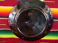 Mexican vintage pottery, a blackware plate from Tlaquepaque, Jalisco, c. 1930's. It features a very beautiful rural scene and a wonderful floral border. Photo of the back side of the plate.