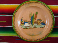 Mexican vintage pottery and ceramics, a lovely terra-cota plate from Tlaquepaque, Jalisco, c. 1940. The peach-colored background glazing is beautiful. The scene on the plate is exceptional; it features a snoozing campesino in a wonderful rural setting. Main photo of plate.