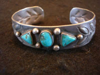 Native American Indian vintage sterling silver jewelry, a Navajo bracelet with beautiful Kingman, Arizona, turquoise and bump-out stamping, c. 1940's.