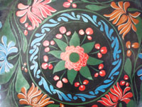 Mexican vintage wood-carving and folk art, a hand-carved laquer-ware batea with wonderful artwork, Uruapan, Michoacan, c. 1930's. The batea features lovely floral decorations, painted on top of the fine laquer finish.  Closeup photo of the floral decorations on the batea.