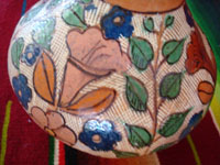 Mexican vintage pottery and ceramics, a beautiful petatillo pottery vase from Tonala, c. 1930's, attributed to the great artist Balbino Lucano. Closeup photo of the floral designs on the vase.