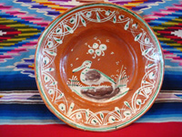 Mexican vintage pottery and ceramics, a bandera-ware plate with a graceful pelican and wonderfully intricate border, Tonala or Tlaquepaque, Jalisco c. 1930's. Main photo.