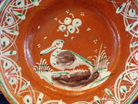 Mexican vintage pottery and ceramics, a bandera-ware plate with a graceful pelican and wonderfully intricate border, Tonala or Tlaquepaque, Jalisco c. 1930's. Closeup of the pelican on the front of the plate.