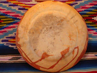 Mexican vintage pottery and ceramics, a bandera-ware plate with a graceful pelican and wonderfully intricate border, Tonala or Tlaquepaque, Jalisco c. 1930's. Photo of the back side of the plate.
