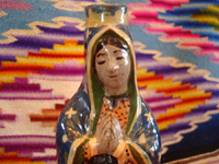 Mexican vintage pottery and ceramics, a beautiful pottery holy-water bottle in the image of Our Lady of Guadalupe, Tlaquepaque c. 1940. Closeup photo of Our Lady's face.