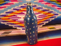 Mexican vintage pottery and ceramics, a beautiful pottery holy-water bottle in the image of Our Lady of Guadalupe, Tlaquepaque c. 1940. Photo of the back of the bottle.