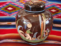 Mexican vintage pottery and ceramics, a large, lidded black-ware tibor, Tlaquepaque, Jalisco, c. 1920's. Photo of artwork on another side of the jar or tibor.