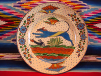 Mexican vintage pottery and ceramics, a very fine pottery plate featuring a leaping wolf, a blue bunny, butterflies and lovely foliage, with a starry-night background, from Tlaquepaque, Jalisco, c. 1920's. Main photo.