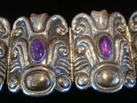 Mexican vintage sterling silver jewelry, and Taxco vintage silver jewelry, a beautiful sterling silver repousse bracelet with amethyst, Taxco, c. 1940's.  Closeup photo of a part of the Taxco silver jewelry bracelet.