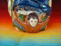 Mexican vintage pottery and ceramics, a lovely pottery bottle depicting Our Lady of Guadalupe, Tonala or San Pedro Tlaquepaque, c. 1940's.  Closeup photo of the angel at Our Lady's feet.