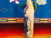 Mexican vintage pottery and ceramics, a lovely pottery bottle depicting Our Lady of Guadalupe, Tonala or San Pedro Tlaquepaque, c. 1940's.  A side view of the figure.