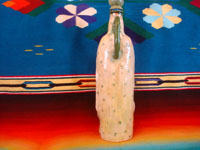 Mexican vintage pottery and ceramics, a lovely pottery bottle depicting Our Lady of Guadalupe, Tonala or San Pedro Tlaquepaque, c. 1940's.  A photo showing the back of the figure, highlighting Our Lady's robe.