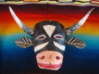 Mexican vintage woodcarvings and masks, a wonderful wooden mask depicting and animated and charming bull, or Torito, Michoacan, c. 1940's.  Main photo of the mask.