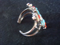 Native American vintage sterling silver jewelry, and Zuni vintage silver jewelry, a beautiful Zuni bracelet with the figures of two Rainbow Men with turquois, mother-of-pearl, coral, and jet stones, New Mexico, c. 1940's. A side view of the Zuni bracelet.
