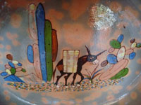Mexican vintage pottery and ceramics, a large Tlaquepaque pottery bowl with wonderful artwork including a burro with a heavy load of sugar cane amidst lovely cacti, Tonala or Tlaquepaque, Jalisco, c. 1940's. Closeup photo of the burro on the front of the bowl.