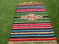 Mexican vintage textiles and Saltillo serapes (sarapes), a very beautiful Saltillo-stlyle serape with a wonderful center medallion and beautiful colors against a black background, c. 1940's.  Main photo of the serape.