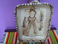 Mexican vintage pottery and ceramics, a wonderful pottery dish in the traditional style of Tzintzuntzan, Michoacan, with naive and very endearing artwork, Tzintzuntzan, Michoacan, c. 1950's. Main photo of the dish showing the woman holding branches.