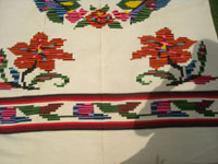 Mexican vintage textiles and serapes, a fabulous textile with wonderful floral designs and brilliant colors, Contla, Tlaxcala, c. 1940's.  Closeup photo of one edge of the textile.