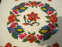 Mexican vintage textiles and serapes, a fabulous textile with wonderful floral designs and brilliant colors, Contla, Tlaxcala, c. 1940's.  Closeup photo of the center medallion of the textile.