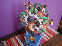 Mexican vintage folk art, and Mexican vintage pottery and ceramics, a wonderful pottery ferris wheel filled with happy people and very colorful decorations, Ocumicho, Michoacan, c. 1980's. Side view of the ferris wheel.