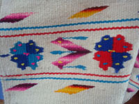 Mexican vintage textiles and sarapes, a beautiful child's poncho with wonderful floral designs, Guadalajara, Jalisco, c. 1950's.  Closeup photo of part of the poncho.