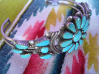 Native American Indian sterling silver jewelry, and Zuni vintage sterling silver jewelry, a beautiful Zuni blossom bracelet of silver and very fine turquoise (possibly Sleeping Beauty), Zuni Pueblo, New Mexico, c. 1950's. Side view of the Zuni silver bracelet.