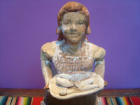 Mexican vintage folk art and pottery, a lovely sculpture of a woman vendor of tamales, Michoacan, c. 1940's. Coseup photo of the woman's face.