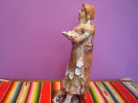 Mexican vintage folk art and pottery, a lovely sculpture of a woman vendor of tamales, Michoacan, c. 1940's. Side view of the statue.