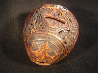 Mexican vintage folk art, a finely carved coconut with scenes from the Mexican Revolution of 1910, c. 1925-35. The carved coconut has the Mexican national emblem of the eagle and snake inlaid in abalone. Main photo.