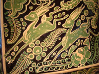 Mexican vintage pottery and ceramics, a rectangular Fantasia dish with wonderful deer, from Tonala or Tlaquepaque, c. 1930. A closeup photo.