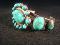Native American Indian vintage silver jewelry, a Navajo sterling silver bracelet with wonderful natural turquoise stones, c. 1920; ingot silver. The turquoise is about the most beautiful you will ever see!  Photo of one side of Navajo ingot silver bracelet.