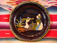 Mexican vintage pottery and ceramics, a blackware plate with wonderful artwork from Tlaquepaque, Jalisco, c. 1930-40's. The plate has a beautiful border and a scene of a campesino carrying his load of wood amidst plants and cacti. This is the second of three plates, probably all by the same great artist. Main photo of plate.