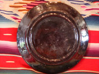 Mexican vintage pottery and ceramics, a blackware plate with wonderful artwork from Tlaquepaque, Jalisco, c. 1930-40's. The plate has a beautiful border and a scene of a lovely house amidst plants and cacti. This is the third Tlaquepaque plate of three, all probably by the same great artist. Photo of the back side of plate.