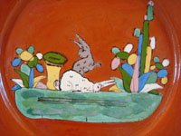 Mexican vintage pottery and ceramics, a plate with two lovely bunnies and a wonderful terra cotta background, Tlaquepaque, Jalisco, c. 1940's. Closeup photo of central scene.