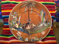 Mexican vintage pottery and ceramics, an incredibly large charger with an intricately painted scene of a campesino returning home with his burro, Tlaquepaque, Jalisco, c. 1920's. Main photo of charger.