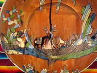 Mexican vintage pottery and ceramics, an incredibly large charger with an intricately painted scene of a campesino returning home with his burro, Tlaquepaque, Jalisco, c. 1920's. Photo of center of charger showing man with his burro.