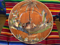 Mexican vintage pottery and ceramics, an incredibly large charger with an intricately painted scene of a campesino returning home with his burro, Tlaquepaque, Jalisco, c. 1920's. Another photo of the entire front of the charger.