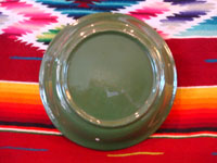 Mexican vintage pottery and ceramics, a lovely green-ware plate with a graceful deer amidst foliage, Tlaquepaque, Jalisco, c. 1930's. Photo of the back side of the plate.