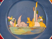 Mexican vintage pottery and ceramics, a lovely blue-ware plate with two playful squirrels, Tlaquepaque, Jalisco, c. 1930's. The artwork is extremely crisp, and the scene is lovely and extremely endearing! Closeup of the central squirrels.
