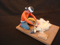 Native American Indian folk-art and wood-carving, a Navajo folk-art wood-carving of a Navajo man shearing his sheep, signed by the artist, c. 1970. Main photo of the Navajo folk-art woodcarving.