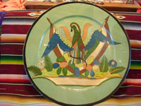 Mexican vintage pottery and ceramics, a magnificent and extremely large charger featuring the Mexican national symbol, an eagle with snake in mouth and two Mexican flags, Tonala or Tlaquepaque, Jalisco, c. 1920-30's. Main photo of charger.