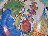 Mexican vintage pottery and ceramics, a burnished Tonala charger with incredibly fine hand-painted decoration, Tonala or Tlaquepaque, Jalisco, c. 1930's. Closeup photo of the decorations on the front of the Tonala burnished pottery charger.