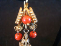 Mexican vintage jewelry, a beautiful pair of gold and coral earrings in a traditional colonial style, c. 1900. An even closer photo of the bottom of one earring.