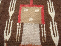 Native American Indian textiles, and Navajo vintage textiles and rugs, a beautiful Navajo textile depicting Navajo spiritual Yei figures, Arizona or New Mexico, c. 1940's. Closeup photo of the face of one of the Navajo Yei figures.